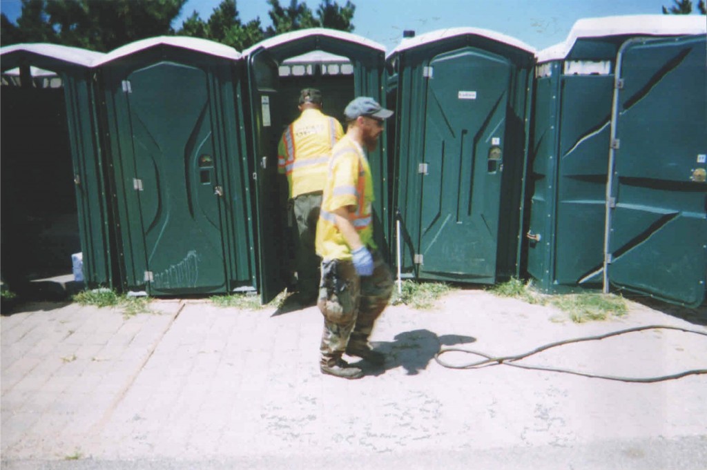 Crew men using the sweet smelling green stuff to sanitize units